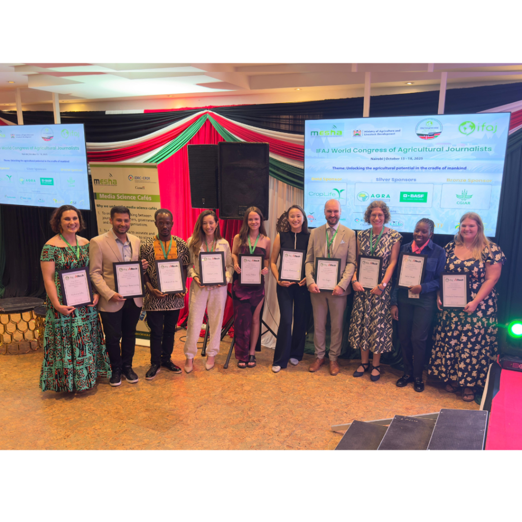 A group of people display their certificates to the camera.